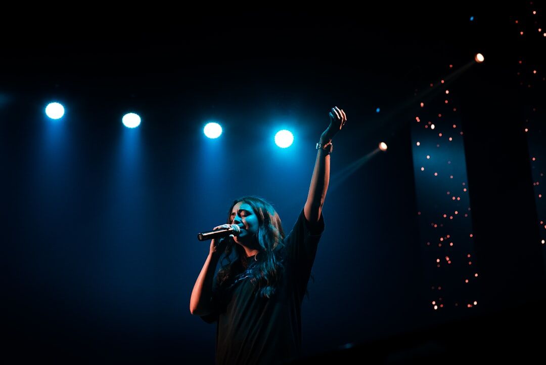 female singer on stage spotlights